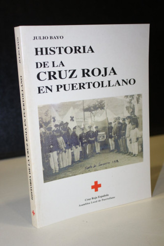 Portada del libro de Historia de la Cruz Roja en Puertollano.- Bayo, Julio.- Dedicado.